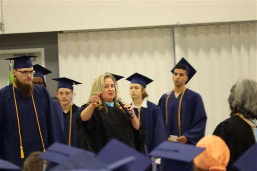 Students receiving instructions before graduation.